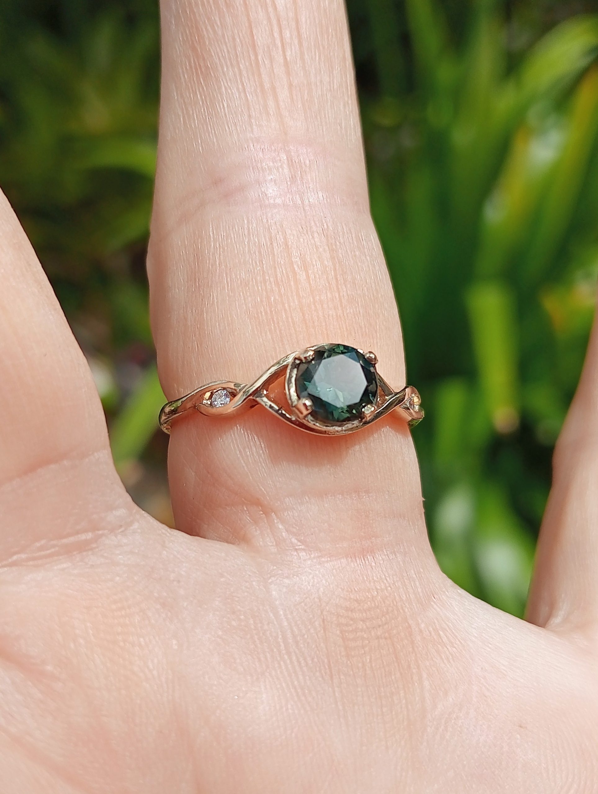 simple elegant twisted band with sapphire and diamonds