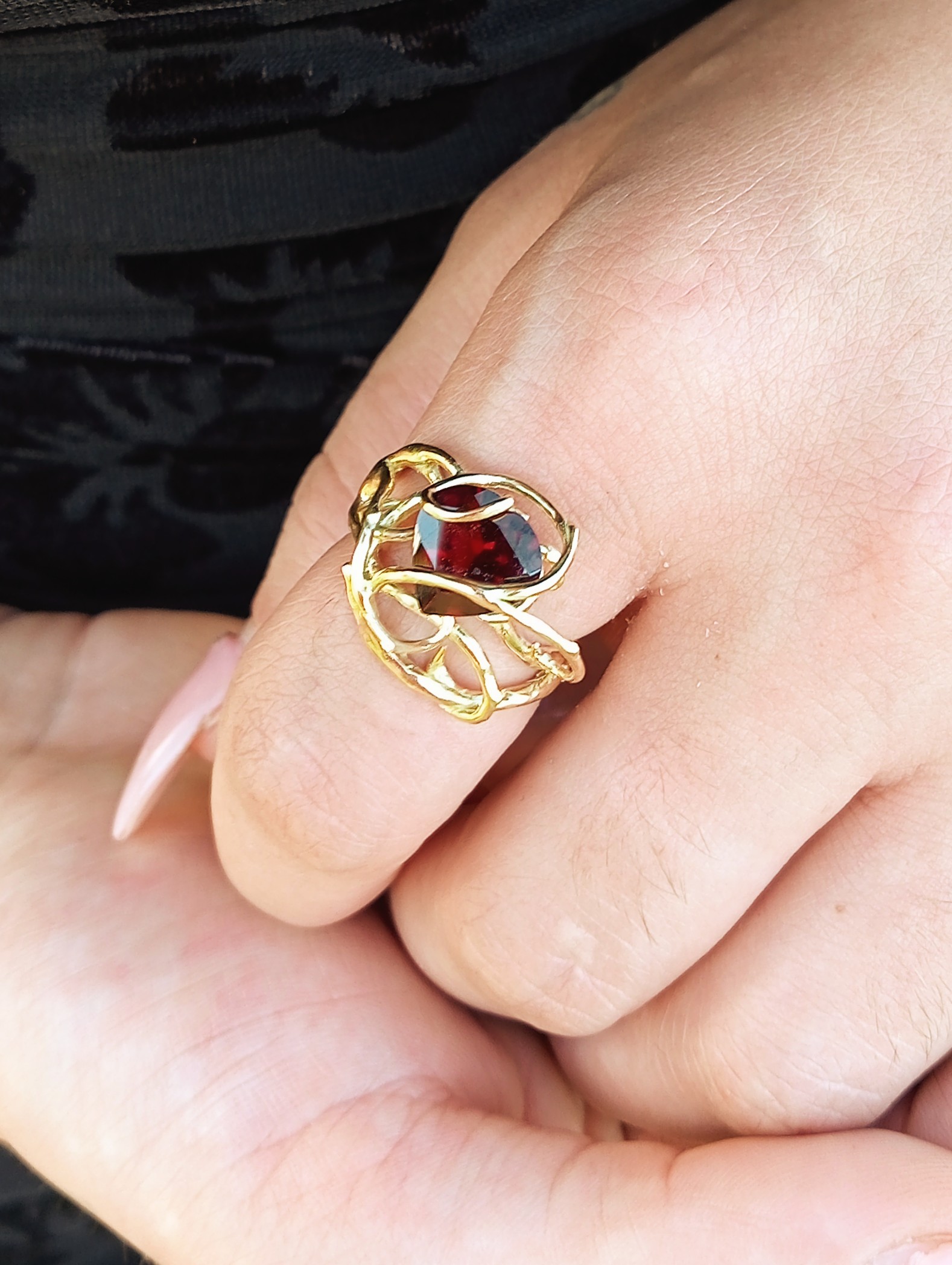 garnet heart ring in thorny vine