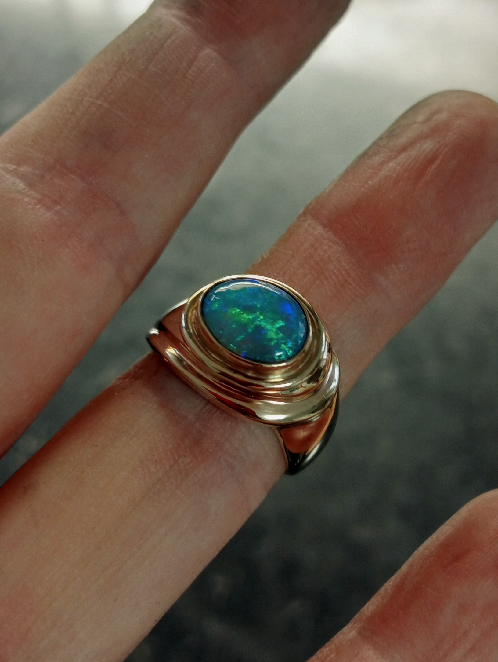 solid opal in curly solid ring