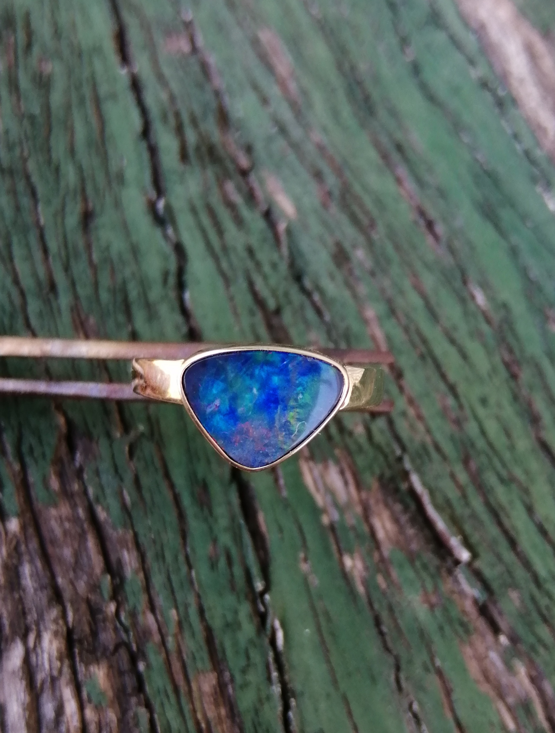 blue opal in gold ring