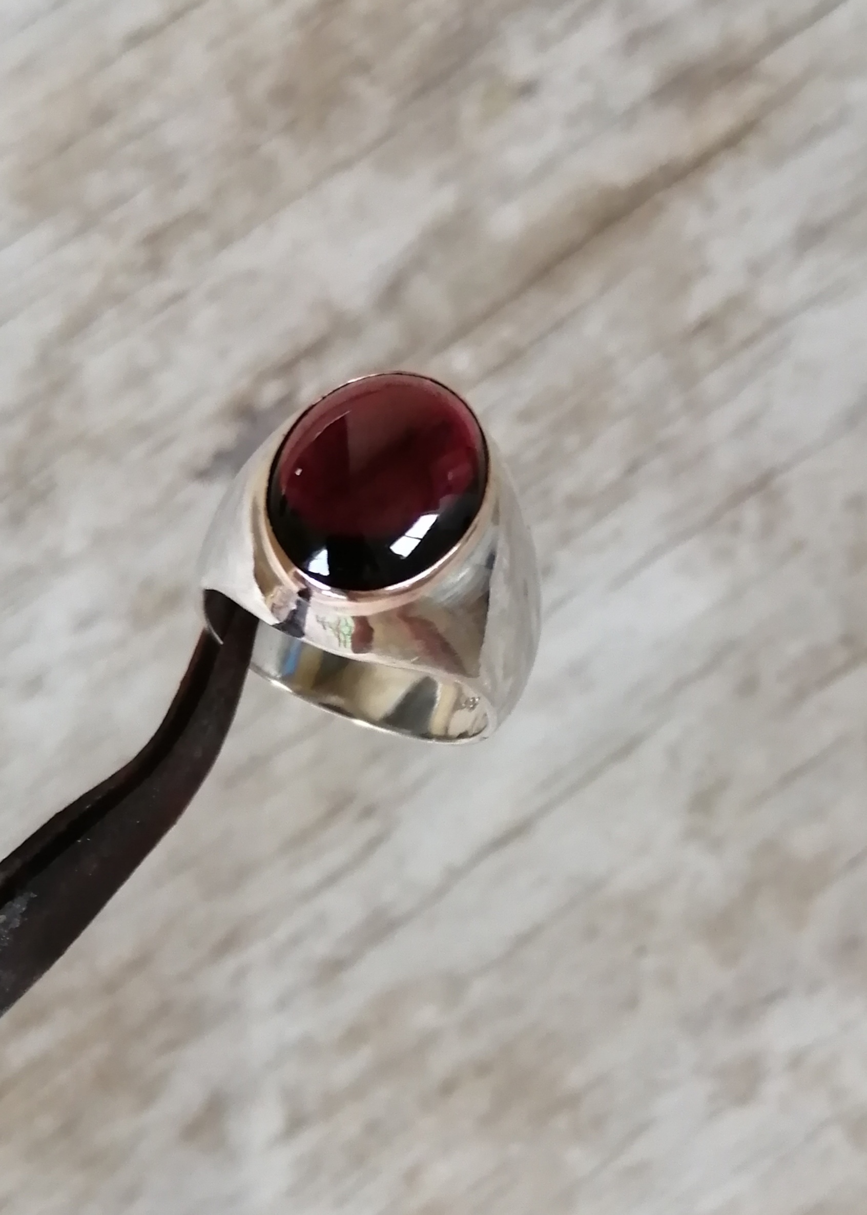 huge cab garnet in gold bezel in silver ring