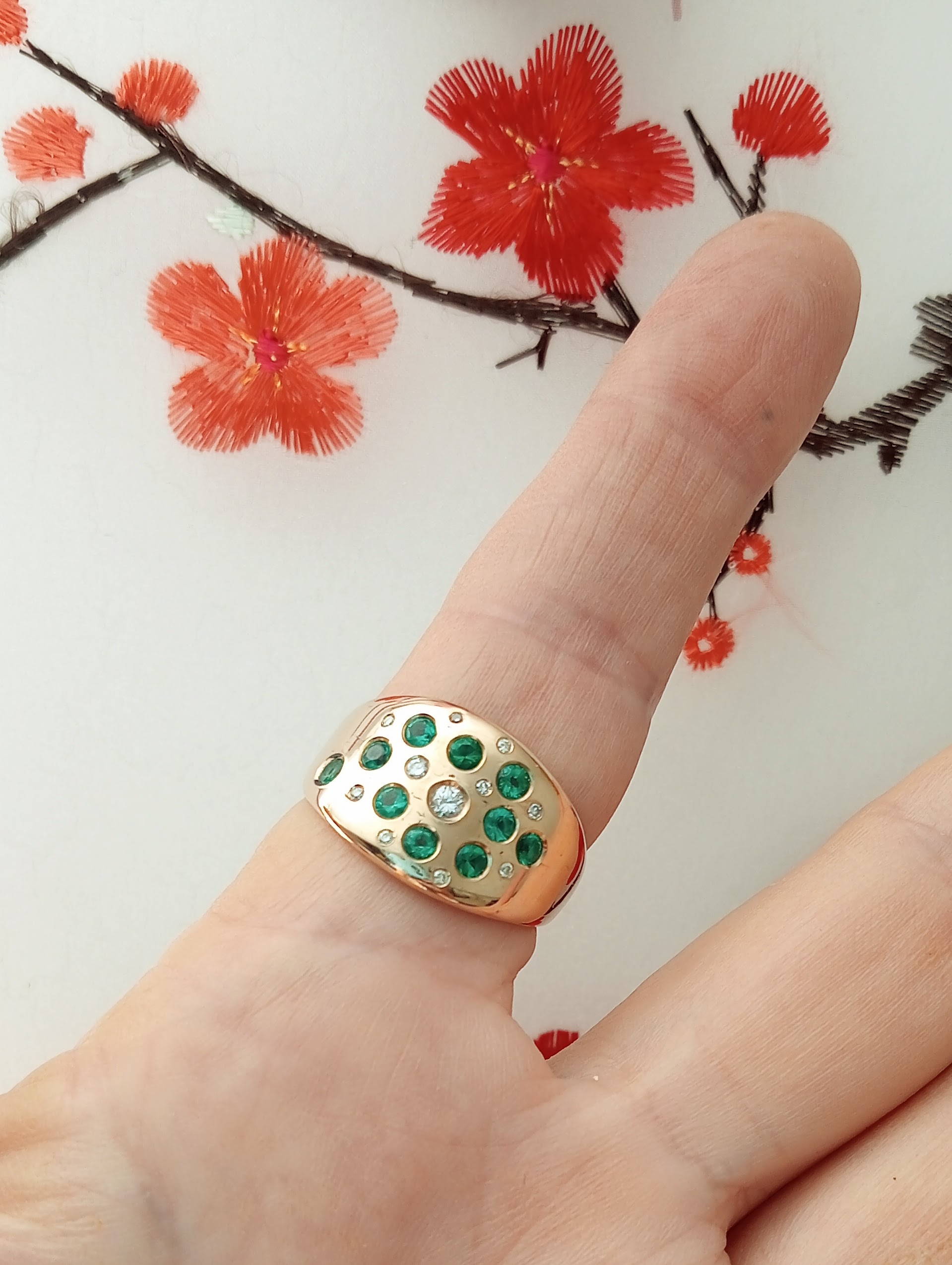 contempoary ring with emeralds and diamonds